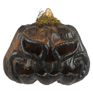 A rustic black smiling carved ceramic jack-o-lantern with a weathered mossy stem perfect for tea light or light cord use