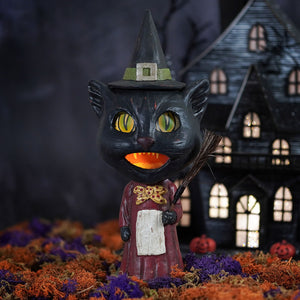 Black witch cat figurine with glowing yellow eyes and maroon robe featuring a gold bow tie called catrina whisker witch for halloween cats