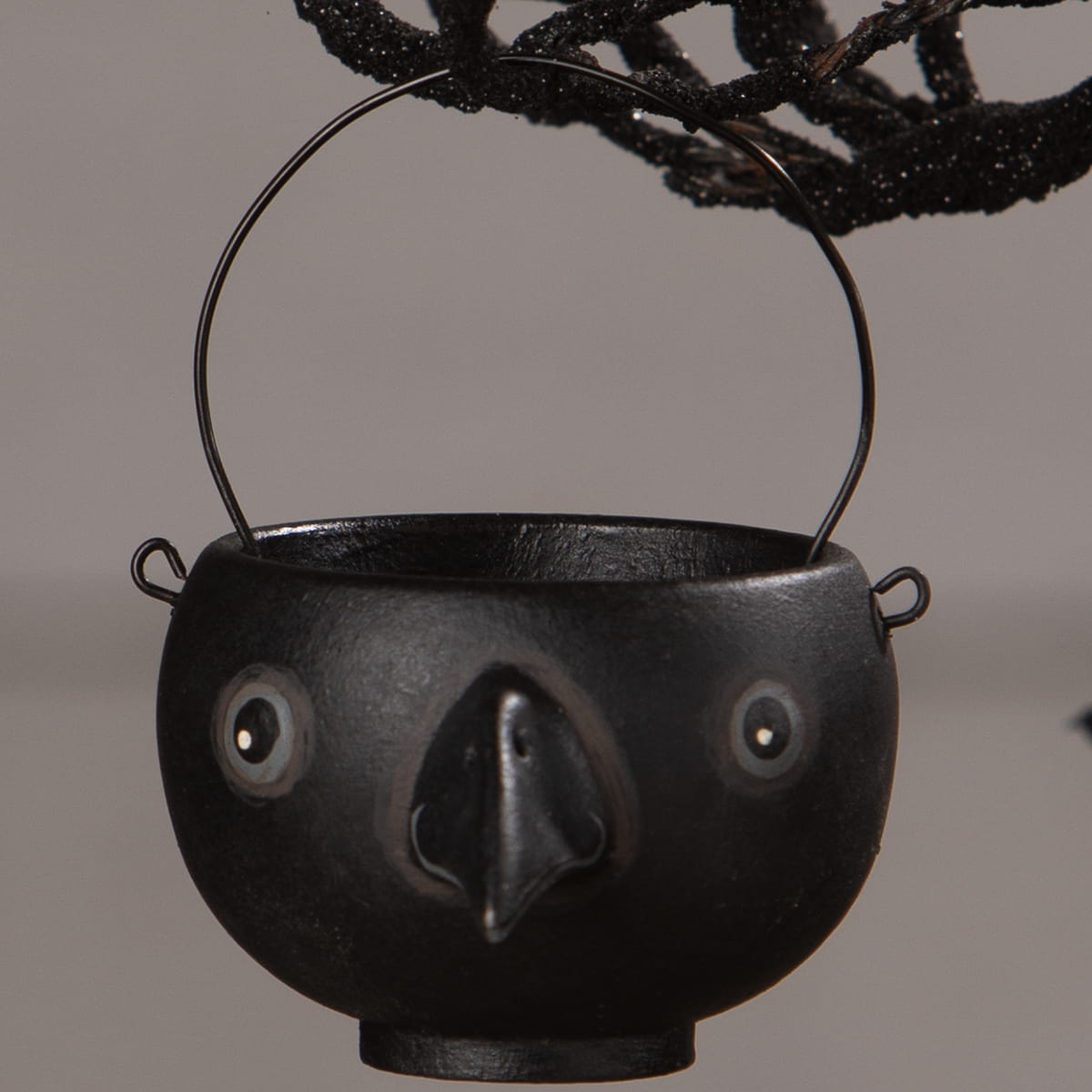 Black ceramic cauldron egg cup with whimsical bird face design by bethany lowe halloween collection