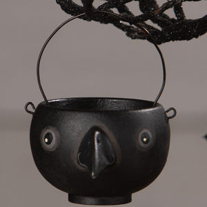 Black ceramic cauldron egg cup with whimsical bird face design by bethany lowe halloween collection