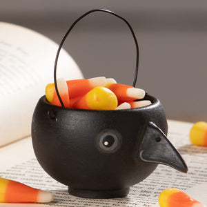 Black ceramic halloween egg cup shaped like a crow with glossy finish and painted eye bethany lowe halloween