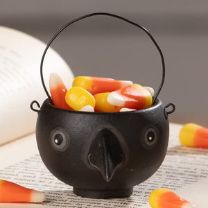 Black ceramic halloween cauldron egg cup with handle and googly eyes filled with candy corn bethany lowe halloween