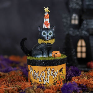 Black plastic halloween cats cecil cat wearing striped party hat and yellow bow tie on orange glittery box