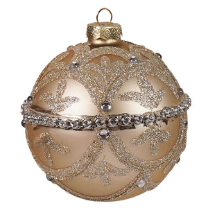 A shimmering gold champagne glass jeweled ball ornament with glittery leaf patterns and metallic vintage reflector accents