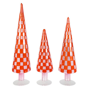 Three checkered patterned red and pink glass tree finials with vibrant orange and white design on clear bases