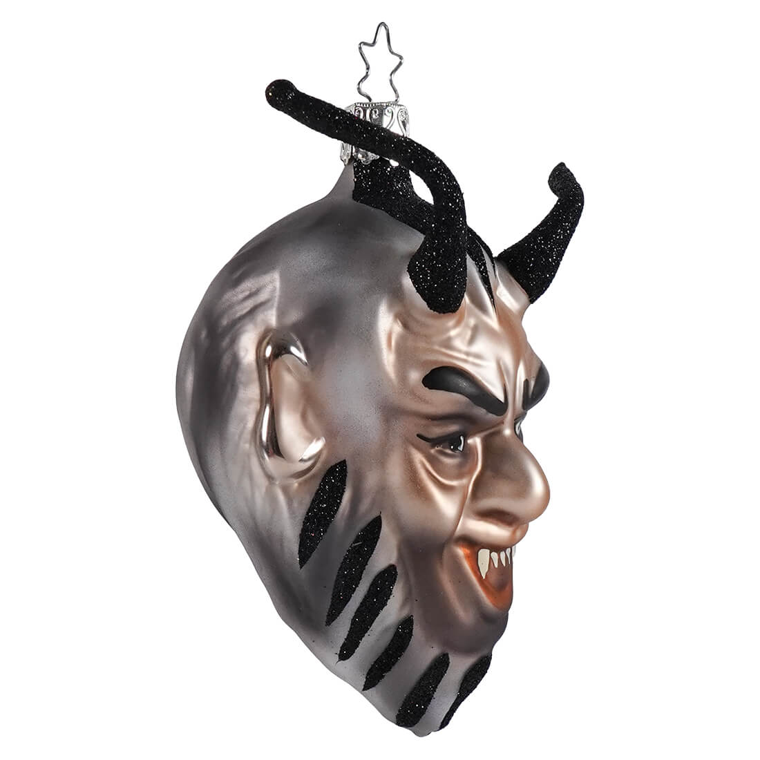 A glossy silver glass cheeky krampus ornament with black glittery horns perfect for christmas decorations and ornaments
