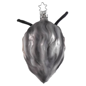 A sleek silver glass krampus ornament with glittery black antennae and a star-shaped top for christmas decorations