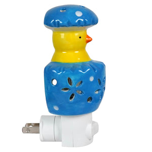 Blue and yellow ceramic chick night light shaped like a duck with mushroom top and decorative cutouts perfect easter lighted decor