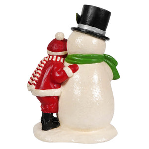 A bethany lowe designs festive resin child hugging snowman in red coat and striped scarf christmas snowman figures decor