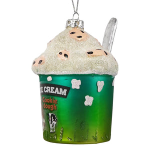 Green glass ice cream ornament with glittery white topping and cookie dough label featuring chocolate chip cookies