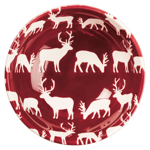 Glossy deep red ceramic plate with white deer pattern, part of a festive christmas bowl set perfect for holiday meals