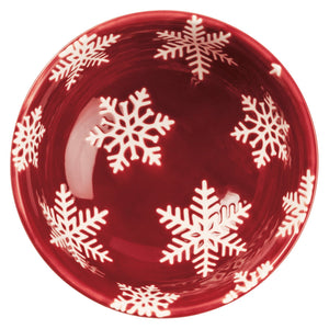Glossy red ceramic christmas bowl with white snowflake patterns from a festive christmas bowl set