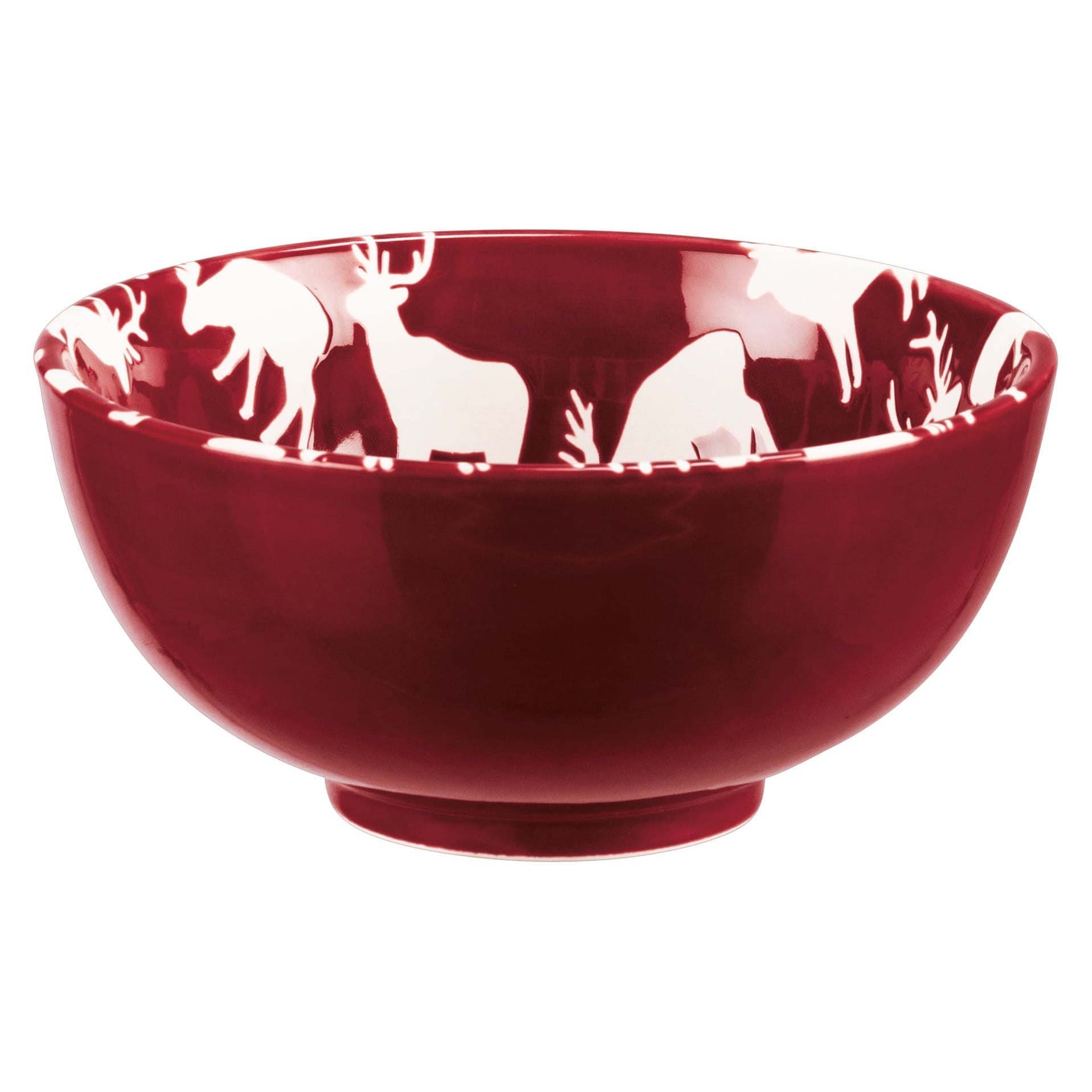 Glossy deep red ceramic christmas bowl with white deer and pine designs along the inner rim in a bowl set