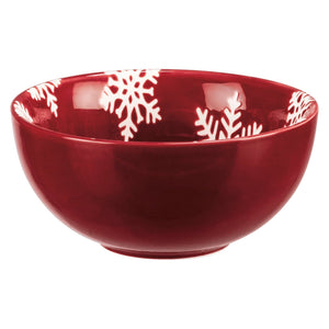A glossy red ceramic christmas bowl with white snowflake patterns perfect for a festive bowl set