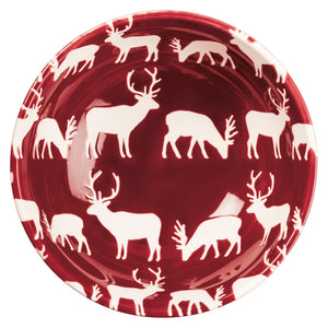 Glossy deep red ceramic plate with white deer pattern, part of a festive christmas bowl set perfect for holiday meals