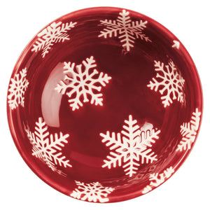 Glossy red ceramic christmas bowl with white snowflake patterns from a festive christmas bowl set