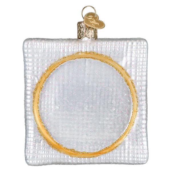 Silver glass christmas cross stitch ornament with textured surface and gold-rimmed cutout perfect figural decor