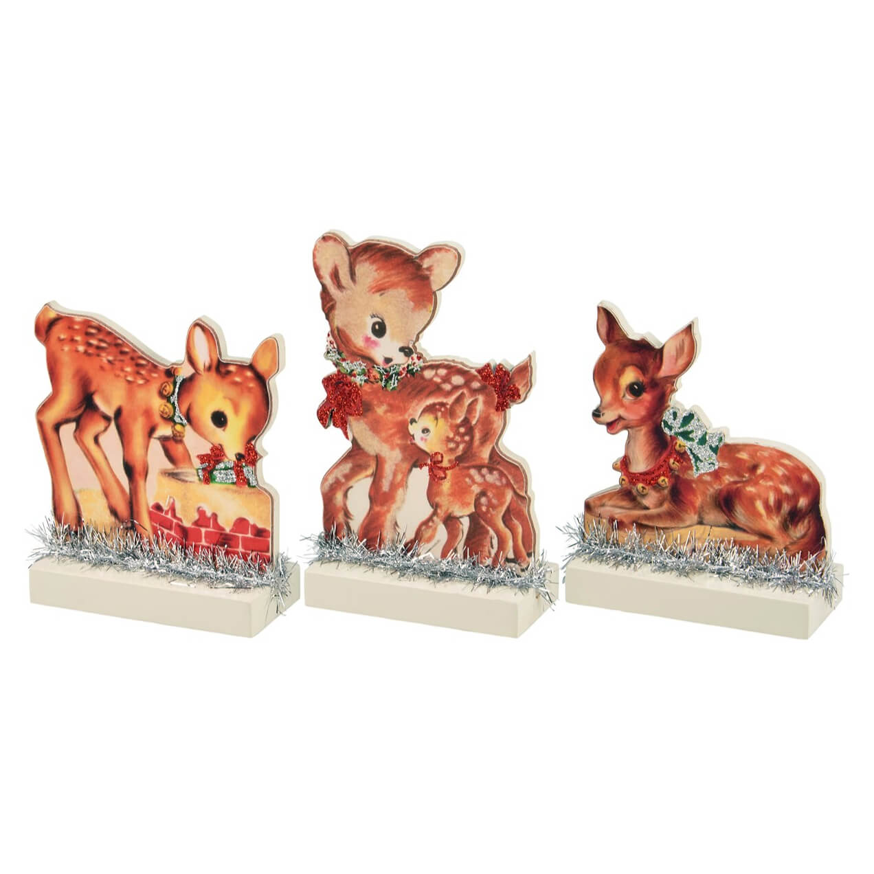 Set of three vintage-style deer figurines with holiday decorations.