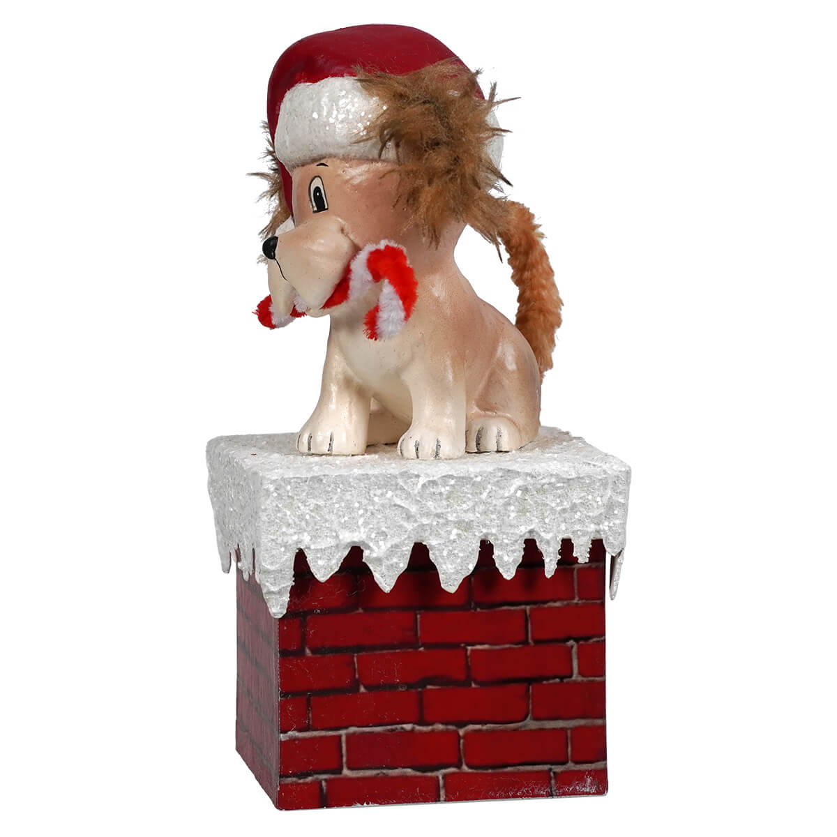 Plush dog wearing a red Santa hat sits atop a decorative brick chimney with snow-like trim.