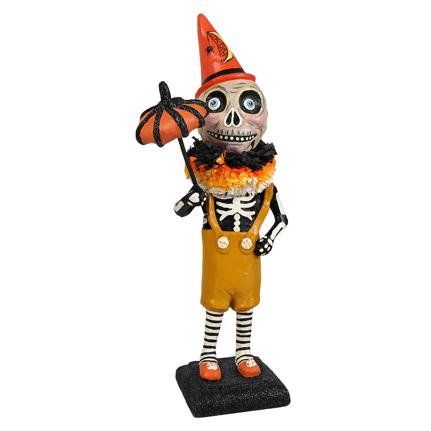 A whimsical circus skelly skeleton decor figure wearing orange cone hat and yellow overalls holding a glittery pumpkin umbrella
