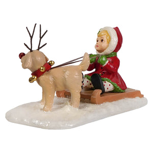 Clare with puppy figurine by bethany lowe shows red-hatted child in red coat on wooden sled with tan reindeer and gold bells