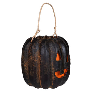 Classic jack face black pumpkin bucket with rustic woven rope handle and glowing orange interior from muffin junction