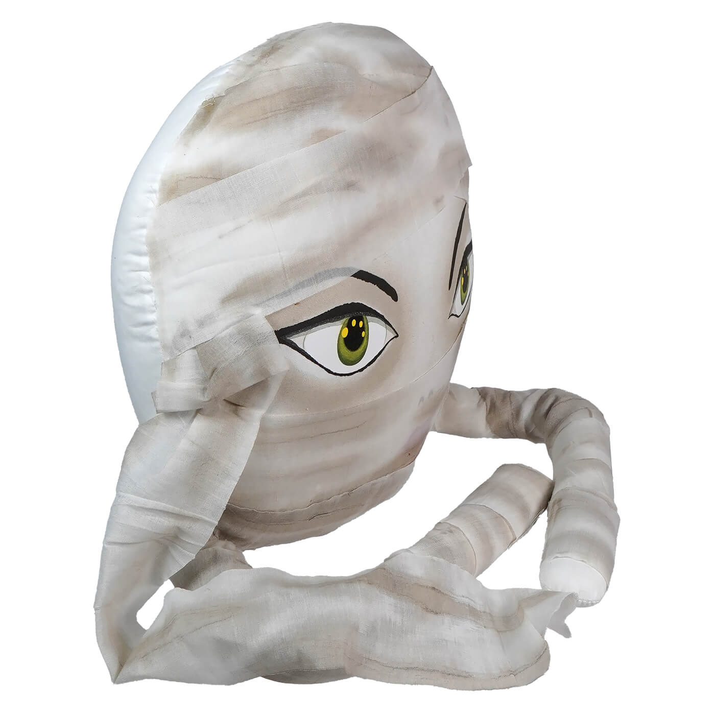 Plush toy or stuffed animal resembling a cartoonish mummy character with one visible green eye.