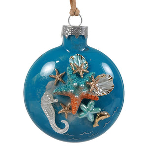 Blue glass coastal sea life christmas ornament with glittery starfish seahorses shells and dolphins design