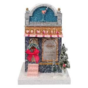 Glittery blue and silver cody foster cocktail bar & lounge with pink awning and christmas tree accents for christmas house