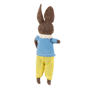 A brown felt coffee rabbit critter wearing a blue textured shirt with white lace collar and yellow checkered pants