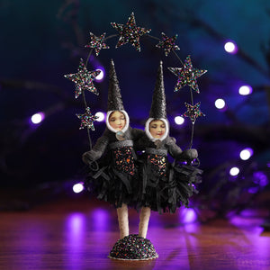 Conjoined sisters black spun cotton witch craft figure with glittery hats and sequined dresses on sparkly base