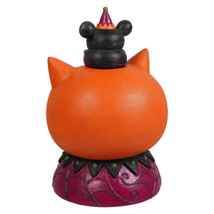 Orange cat shaped halloween cats figurine with black ears and mickey mouse head on a purple spiderweb base