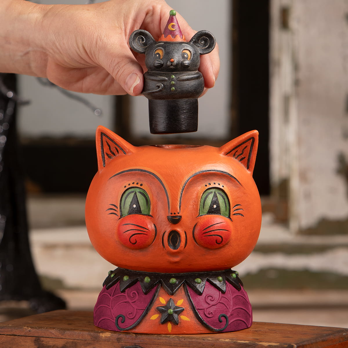 Orange ceramic cat-shaped money box with purple black collar and black mouse figurine party hat perfect for halloween cats decor