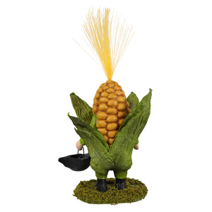 A whimsical bethany lowe corn on the cob gnome figurine in textured yellow and green costume holding a black bucket