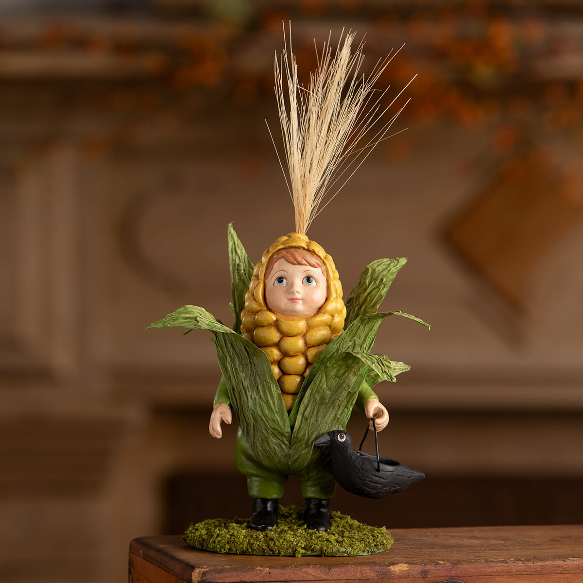A charming bethany lowe corn on the cob figurine featuring a child in a detailed green husk and golden kernel costume