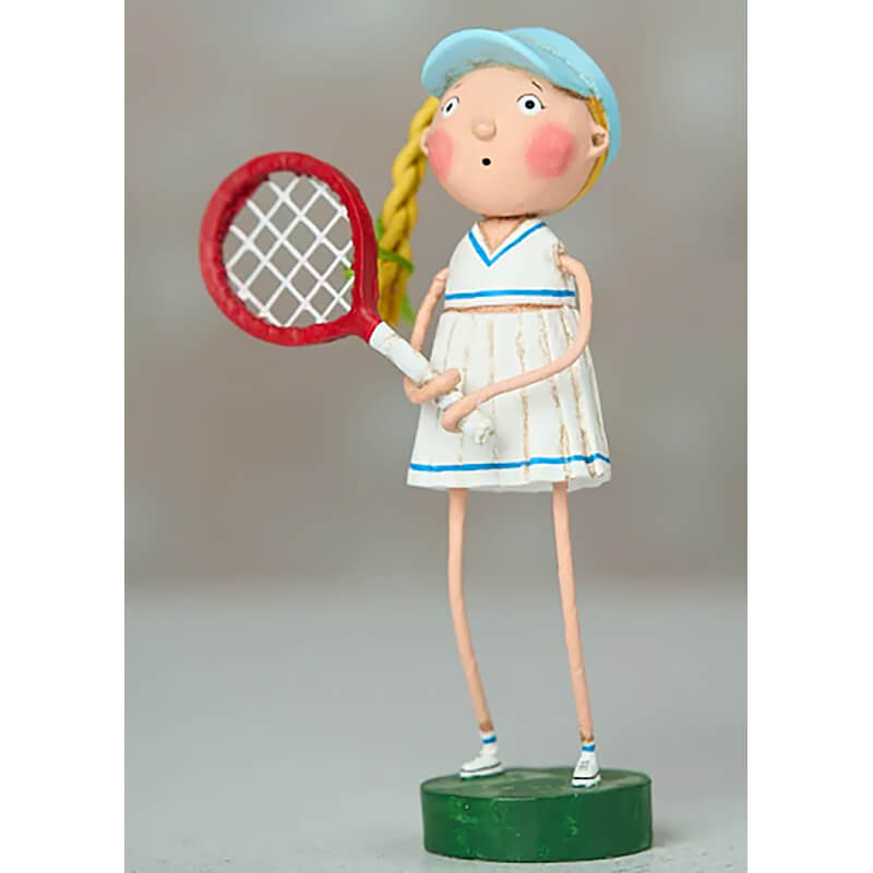 Whimsical figurine of a tennis player wearing a blue cap and white dress while holding a red racquet.