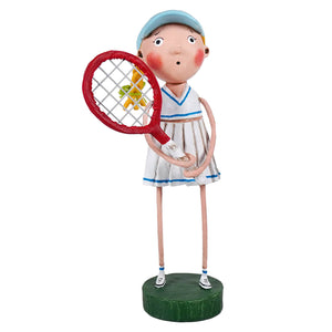 A whimsical lori mitchell patriotic figurine named courtney featuring a young tennis player in white and blue with a red racket