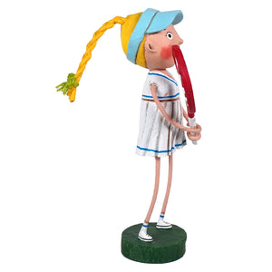 A whimsical lori mitchell patriotic figurine called courtney wearing a white tennis dress with blue trim holding a red racket