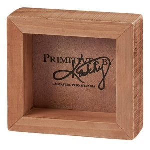 Rustic wooden display box with ’Primitives by Kathy’ text from Lancaster, Pennsylvania.