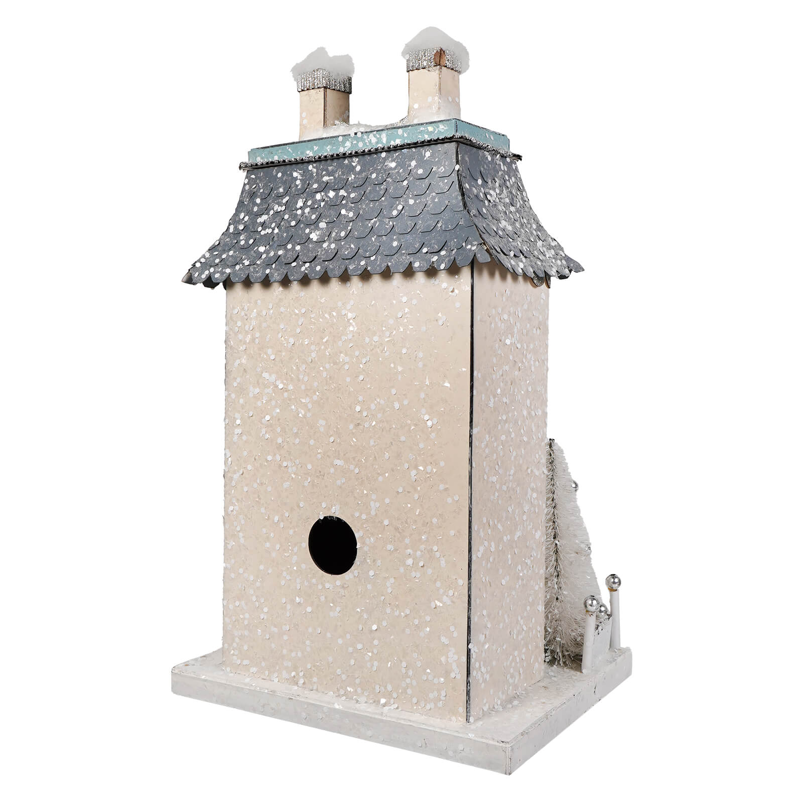 A charming white chateau house birdhouse with a gray snow-dusted roof and two chimneys for your christmas village