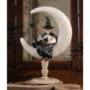 Crescent moon moira halloween witch figurine in black sitting on a silver crescent moon perfect for witch decor