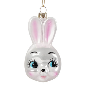 Cute bunny glass ornament made of translucent white glass with pink ears and blue eyes, perfect alongside chinese dragon decor