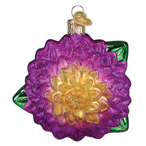 Vibrant purple and gold glass christmas dahlia ornament shaped like a detailed flower with green leaf accents
