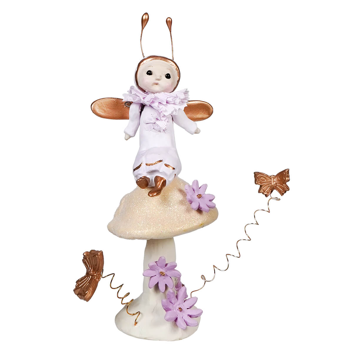 A whimsical doll wearing a white outfit stands atop a mushroom decorated with purple flowers and copper butterflies.