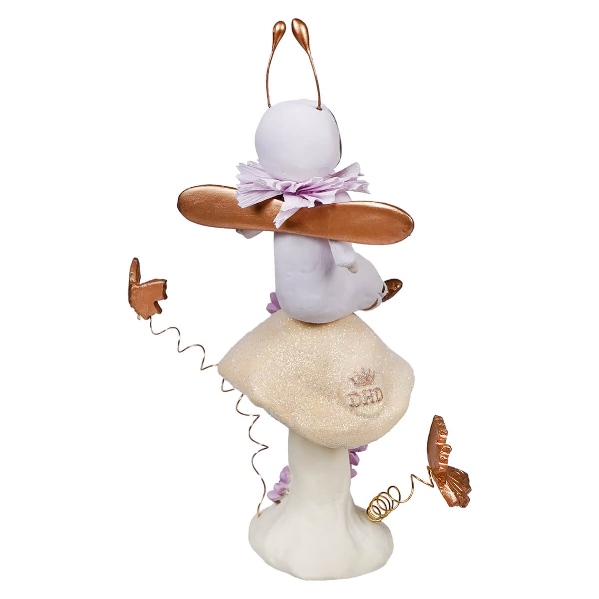 White ceramic bunny figure with copper-colored butterflies and a lavender bow.