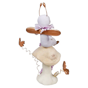 White ceramic bunny figure with copper-colored butterflies and a lavender bow.