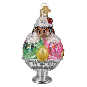 Decadence delight sundae ornament is a colorful glass ice cream ornament with layered scoops and whipped cream topping