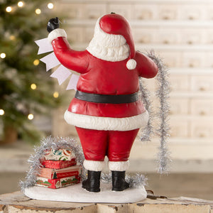 Deck the halls santa bethany lowe designs red white santa figure holding silver tinsel and paper tags folk art santas