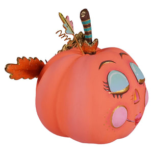 Cute coral pink pixie pumpkin ornament with gold-trimmed face and striped stem for halloween pumpkin display