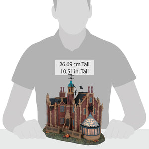 Detailed disney haunted mansion miniature with red brick walls blue tower black slate roof and pumpkins for disney world fans